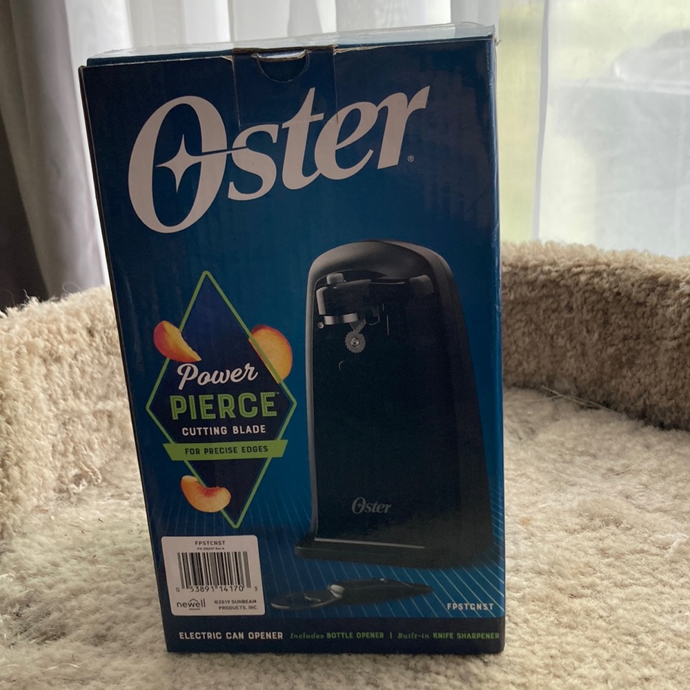 Brand-new Oster electric can opener with built-in knife sharpener